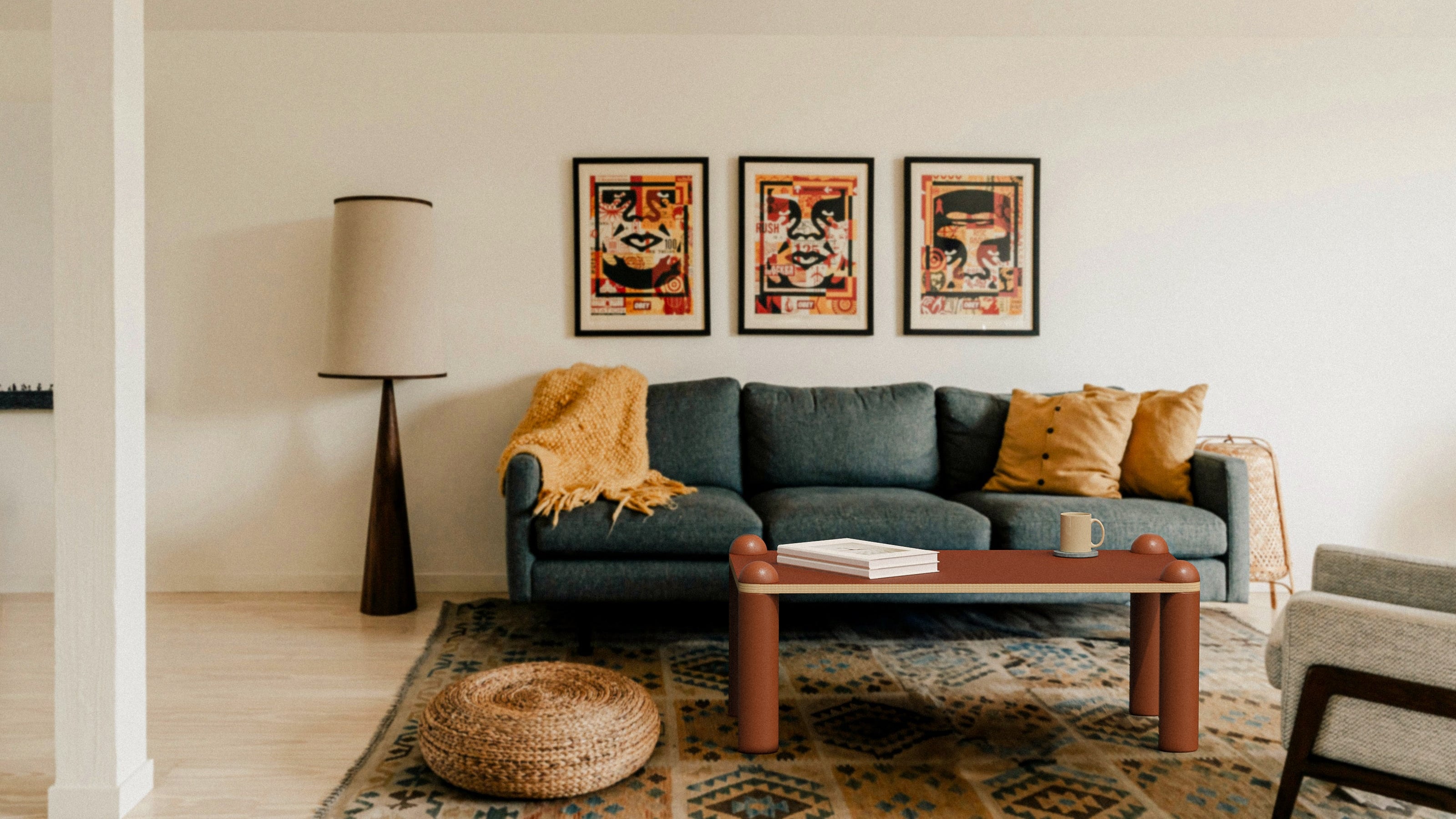Living room with a gray sofa, coffee table, and wall art.