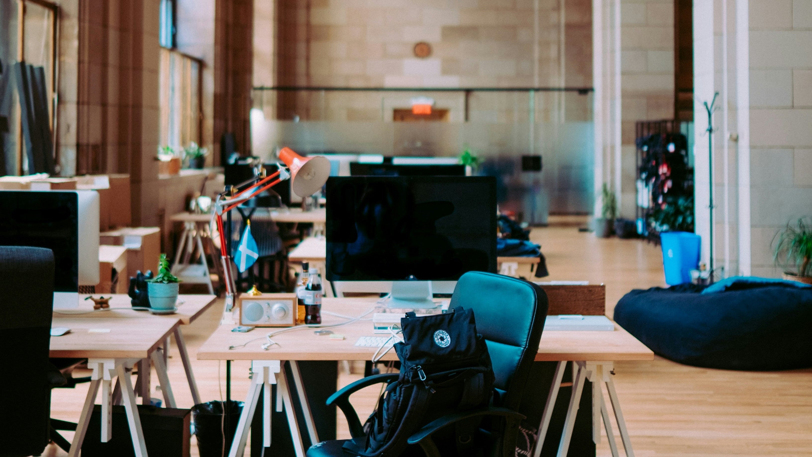 Modern office space with high ceilings and large windows